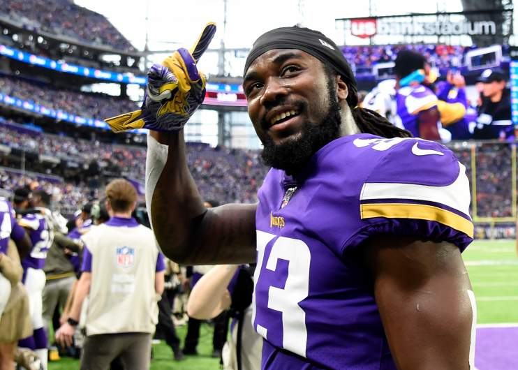 Dalvin Cook greets fans on the U.S. Bank Stadium field