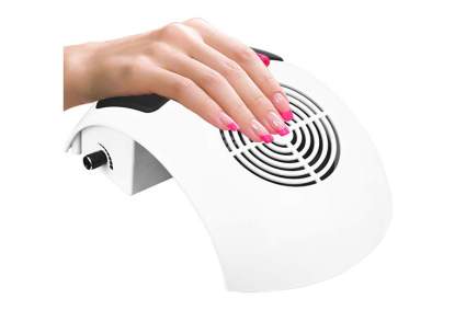 Hand on small nail vacuum fan