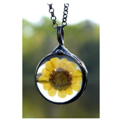 Necklace with yellow pressed flower inside pendant