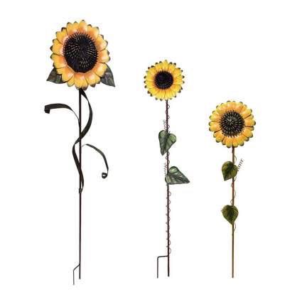 Three metal sunflower garden stakes