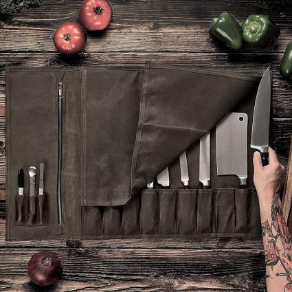 Waxed canvas chef knife roll on cutting board