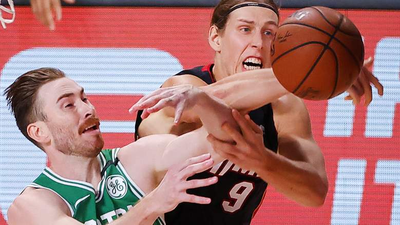 Boston Celtics forward Gordon Hayward, left, battles Miami Heat forward Kelly Olynyk for a rebound.