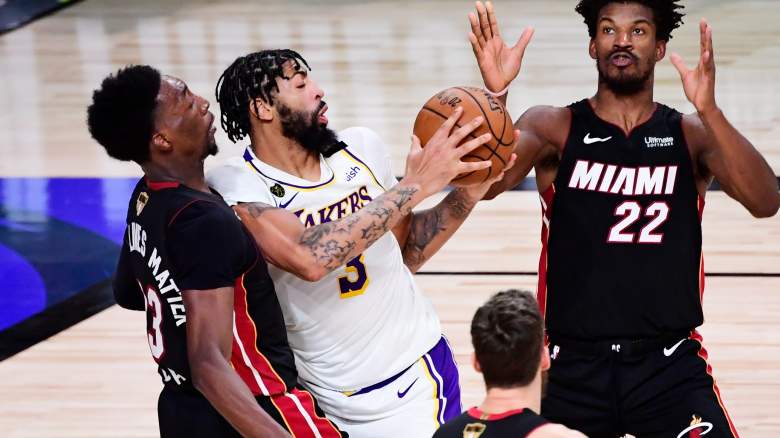 Pat Riley said that Anthony Davis (center) and the Lakers should have an asterisk because of an injury to Bam Adebayo (left).