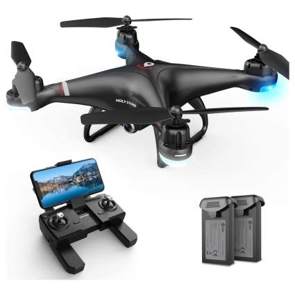 Black drone with controller and smartphone