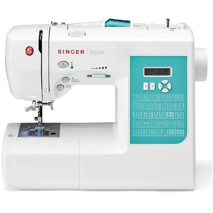 teal and white singer sewing machine