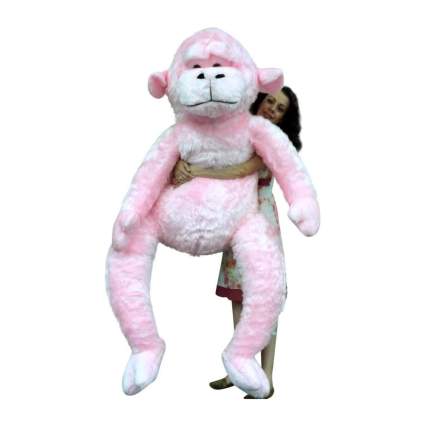 Woman with 6-foot tall pink monkey plush