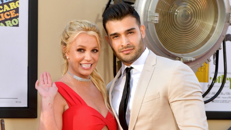Britney Spears and Sam Asghari attend a red carpet event.