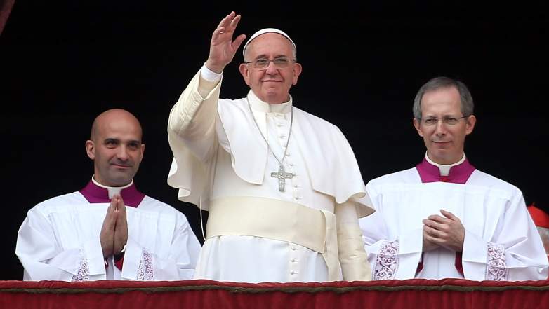 Pope Francis delivers his Christmas Day message from the central balcony of St Peter's Basilica