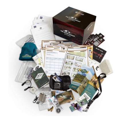 Hunt A Killer series box with papers and camping gear
