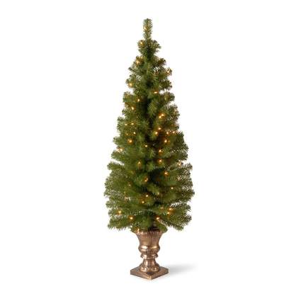 Potted fake Christmas tree with white lights