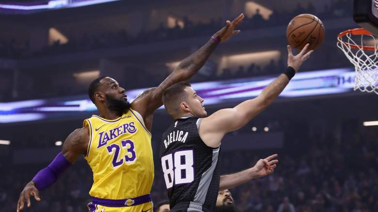 Nemanja Bjelica of the Kings drives against LeBron James and the Lakers