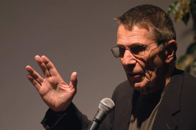 Actor Leonard Nimoy does the vulcan salute as he presents his photography exhibition