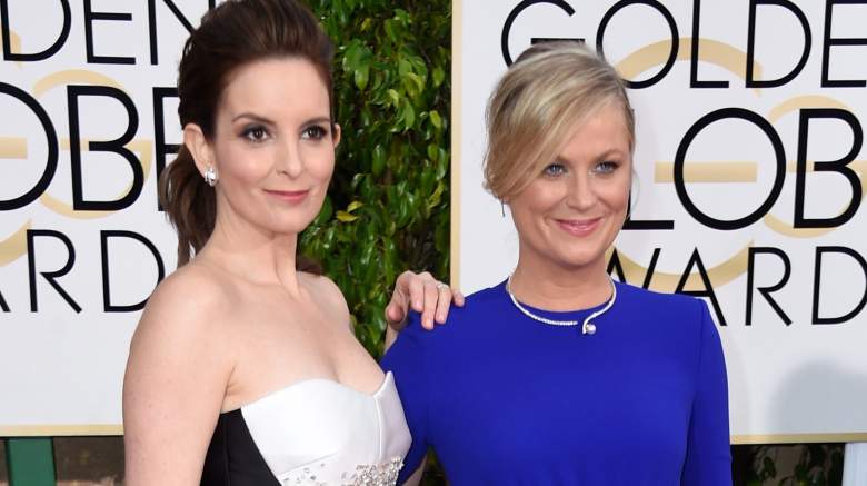 Hosts Tina Fey (L) and Amy Poehler attend the 72nd Annual Golden Globe Awards