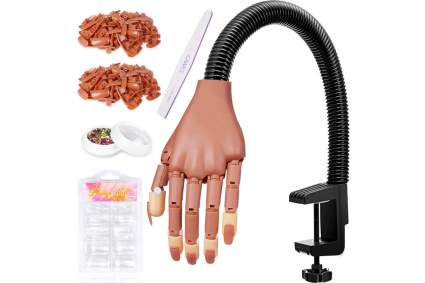 Plastic nail trainer hand with black stand