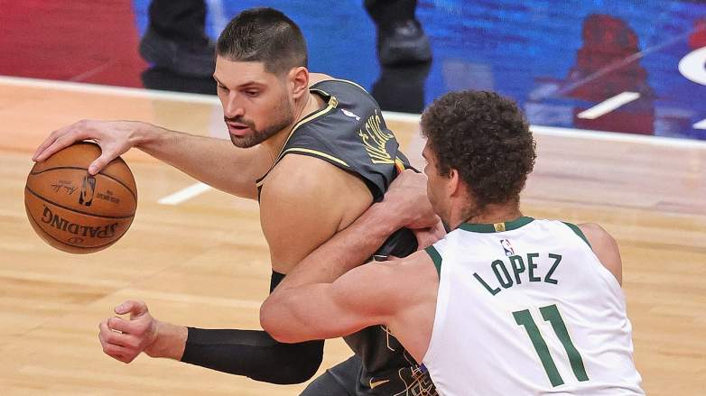 Nikola Vucevic of the Bulls faces off against Brook Lopez of the Bucks