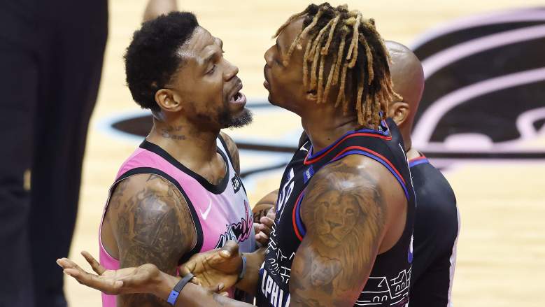 Sixers center Dwight Howard, right, jabbers with Udonis Haslem
