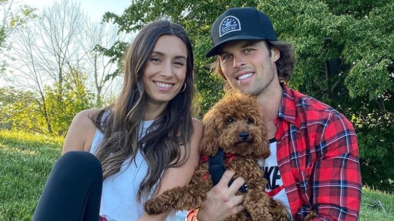 Astrid and Kevin pose with their dog, Ace.