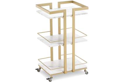 Gold and white marble utility trolley for barbers