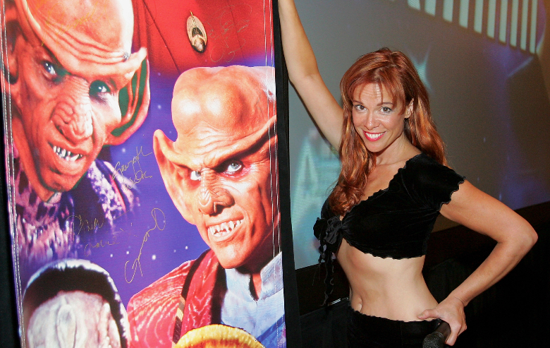 Chase Masterson, who played the character Leeta on the television series "Star Trek: Deep Space Nine," poses next to a banner at the Star Trek convention at the Las Vegas Hilton