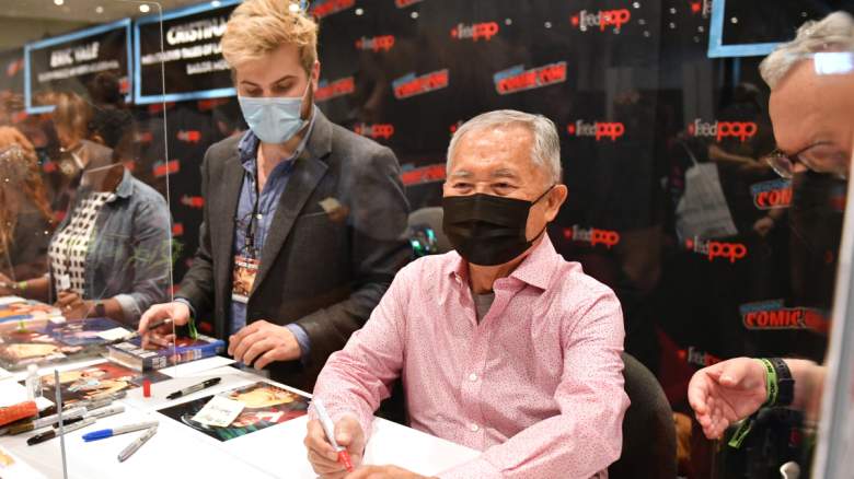 George Takei signs autographs during Day 1 of New York Comic Con 2021 at Jacob Javits Center on October 07, 2021