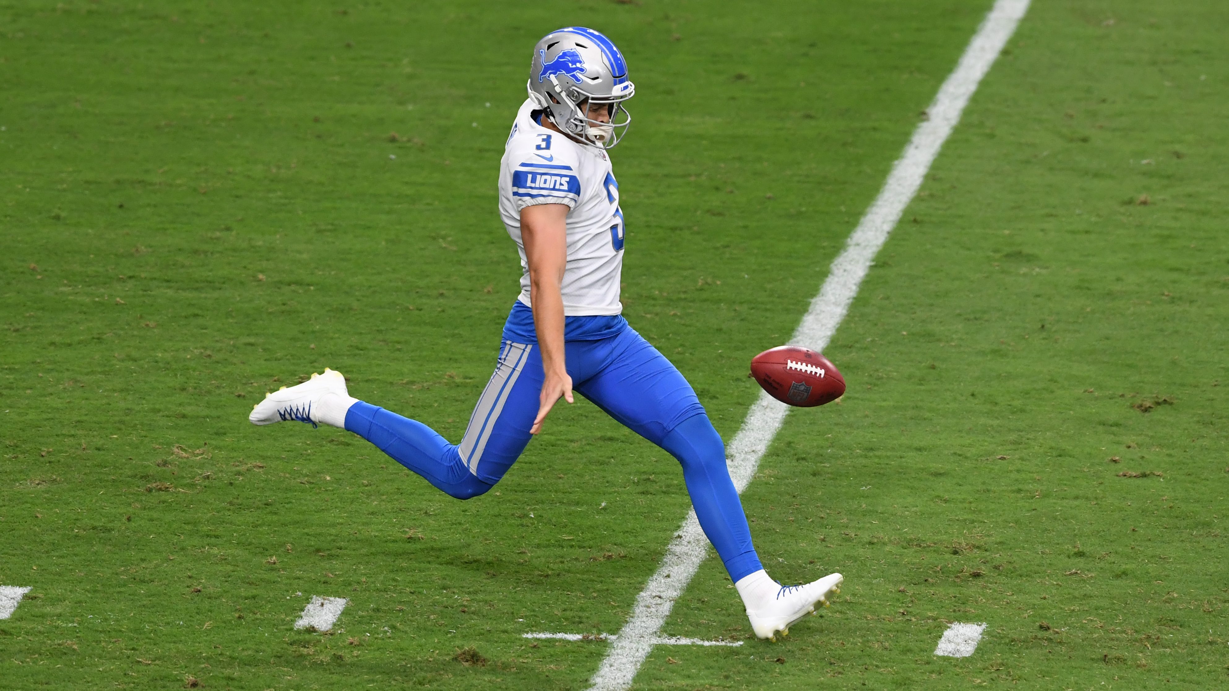 Detroit Lions punter Jack Fox (3) kicks off against the Green Bay