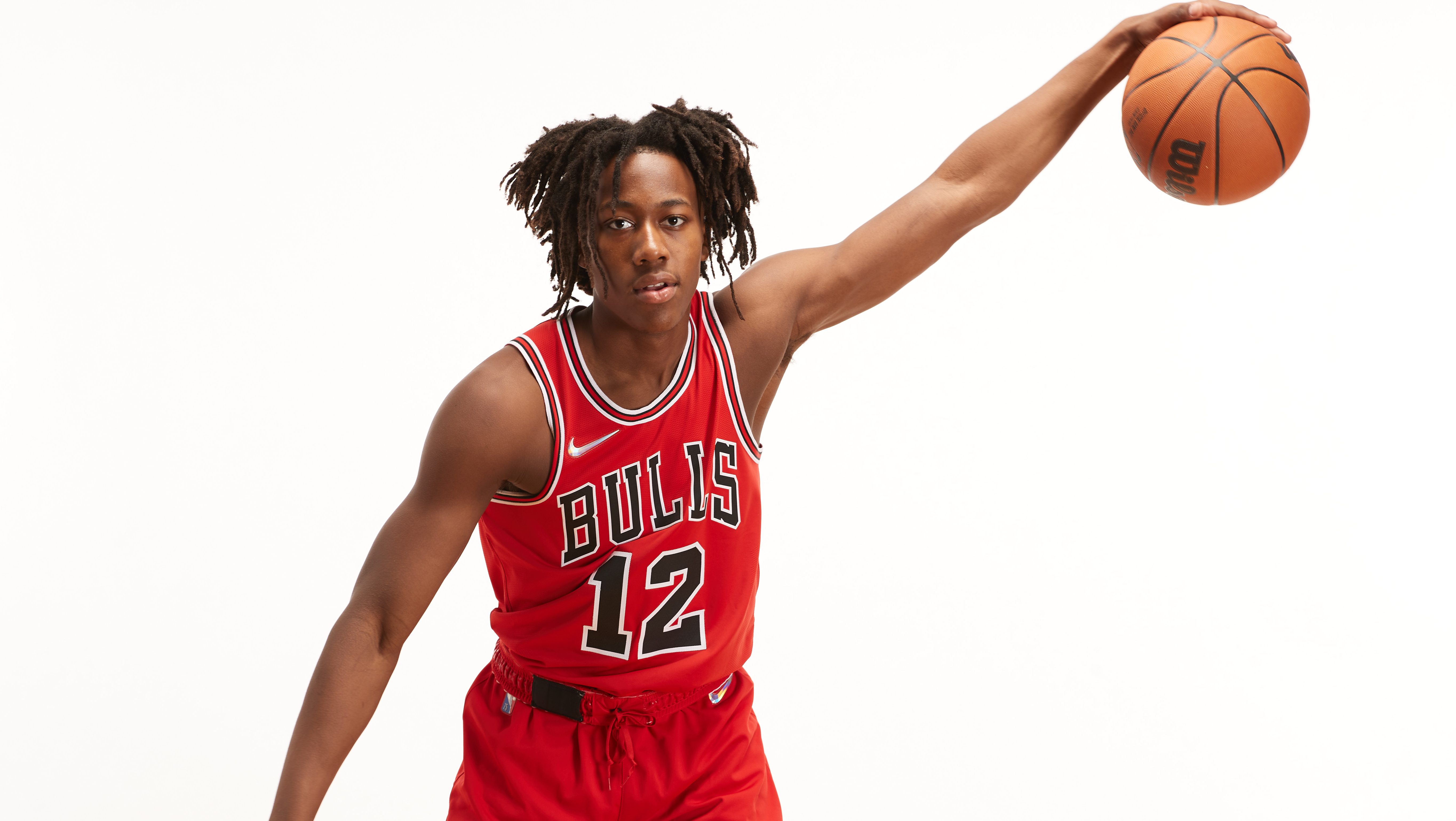 Ayo Dosunmu of the Chicago Bulls shoots a three pointer against