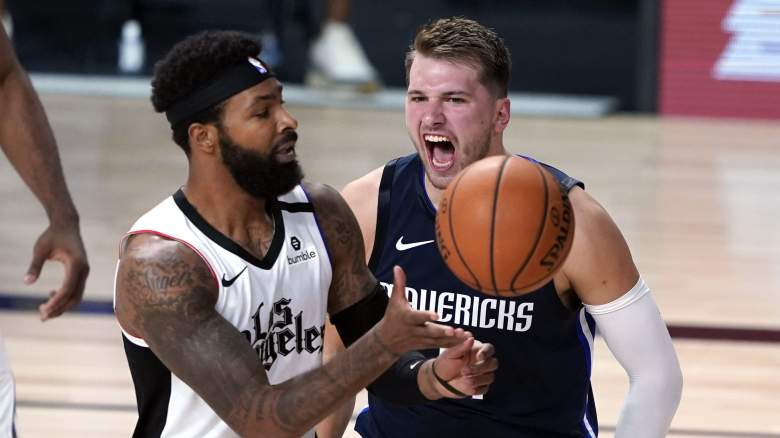Marcus Morris of the Clippers (left) and Luka Doncic, Mavericks.