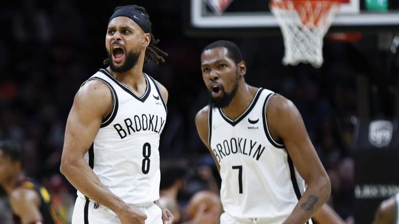Patty Mills (left) and Kevin Durant of the Brooklyn Nets