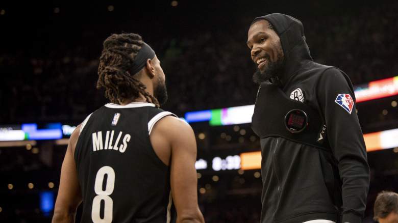 Patty Mills, left, and Kevin Durant of the Nets