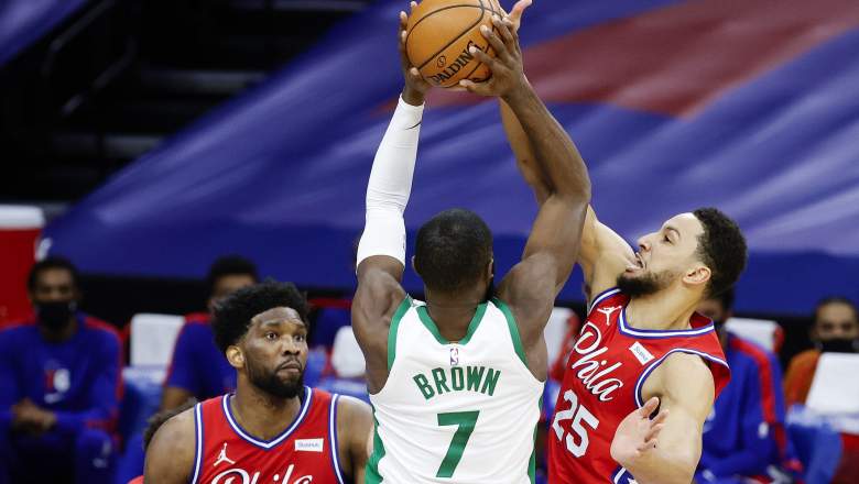 Jaylen Brown of the Celtics, defended by the Sixers' Ben Simmons