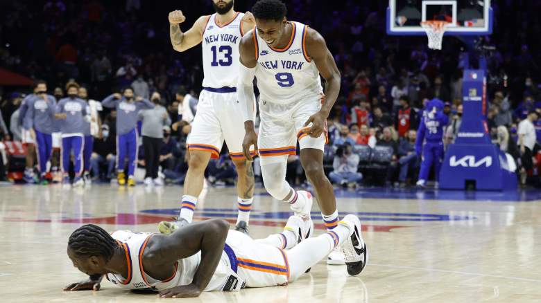 Julius Randle hits the floor after a shove from teammate R.J. Barrett, celebrating a basket in the Knicks' win over the Sixers on Monday.
