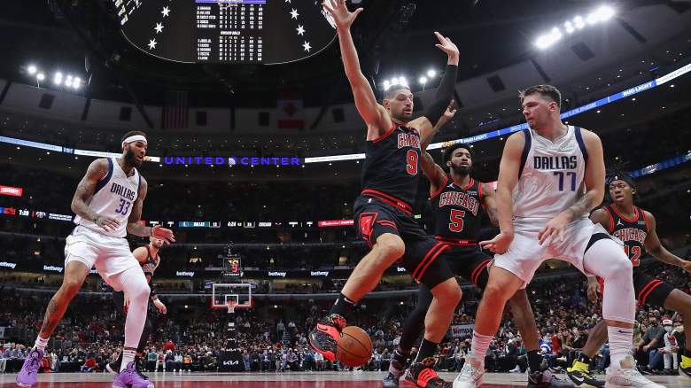 Bulls center Nikola Vucevic (center) tested positive for COVID-19 after playing against the Mavericks on Wednesday