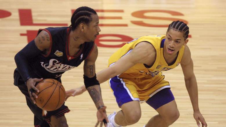 Sixers star Allen Iverson, left, and Ty Lue of the Lakers