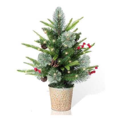 Mini Christmas tree with many types of branches and berries