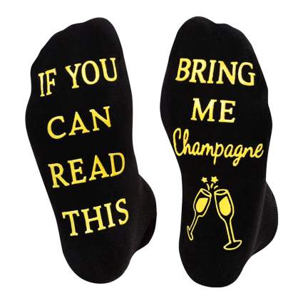 black socks that read "if you can read this bring me champagne"