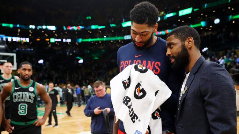 Kyrie Irving talks to Anthony Davis in December 2018.