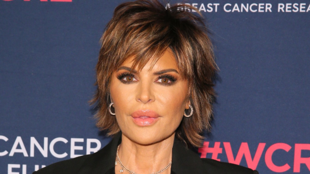 Lisa Rinna attends Laker game in jacket with boxers and bra