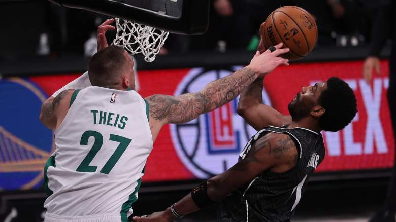Daniel Theis of the Boston Celtics guarding Kyrie Irving of the Brooklyn Nets