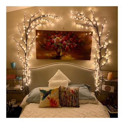 Bedroom with branch lights