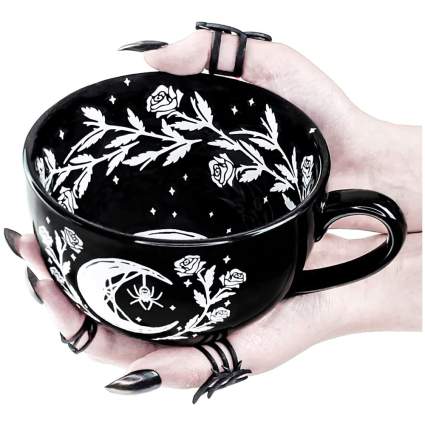 Black widow spider mug with hands