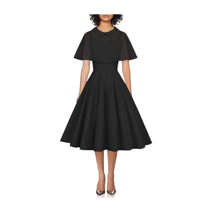 Woman in black 1950s cocktail dress