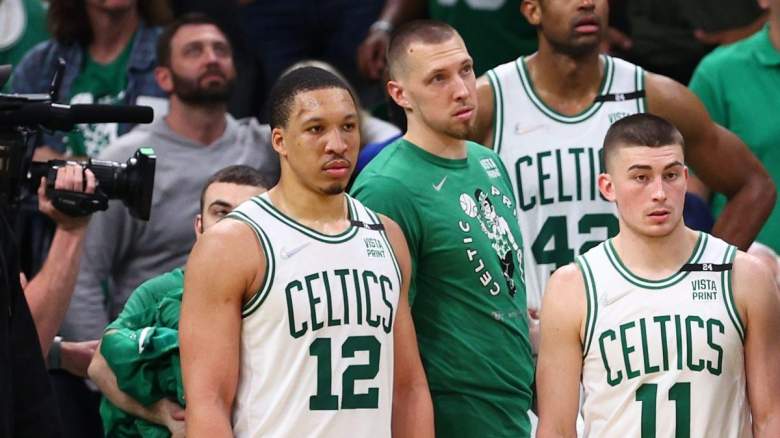 Grant Williams, Payton Pritchard, and Daniel Theis of the Boston Celtics.