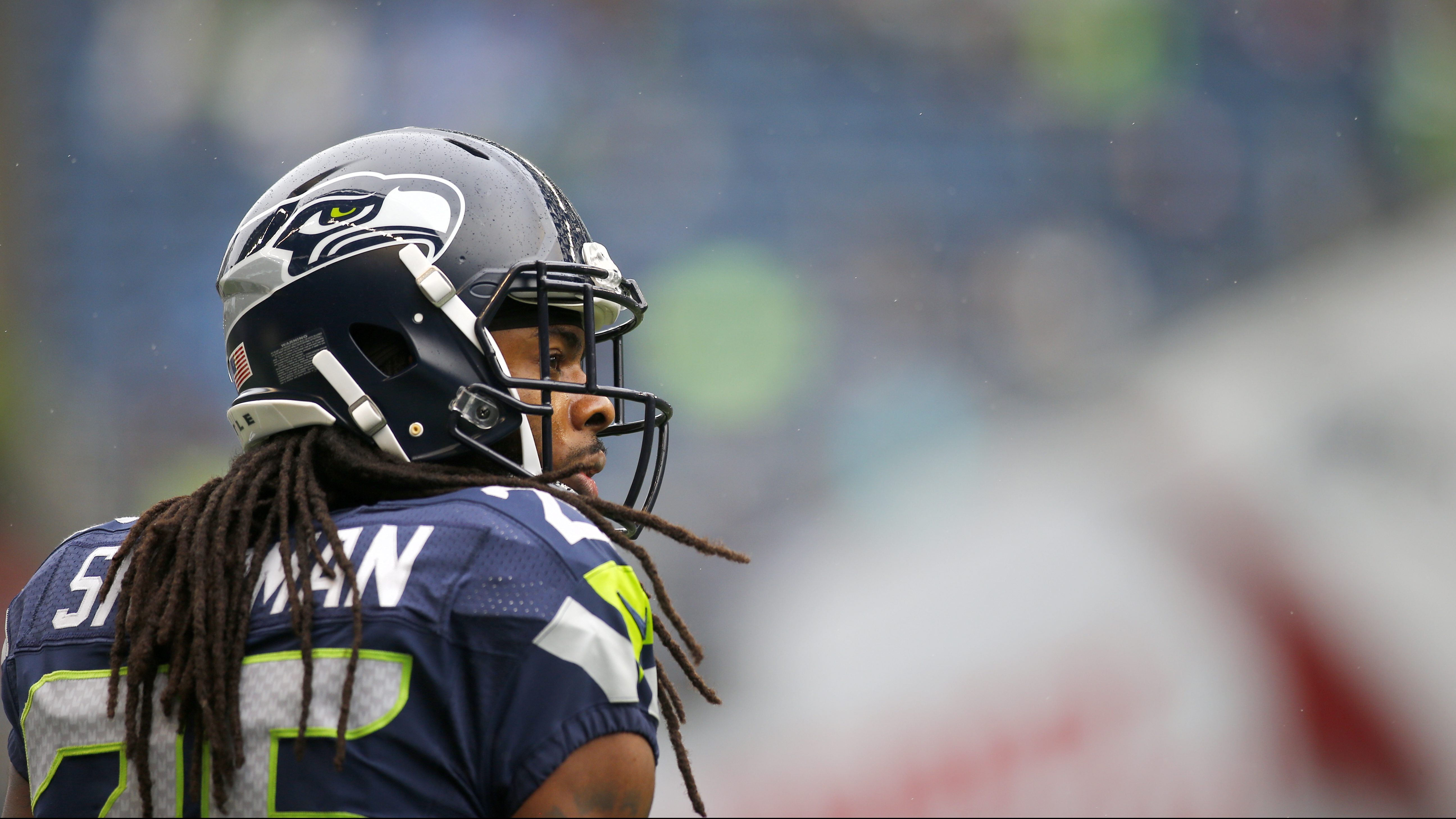 Seattle Seahawks cornerback Tariq Woolen (27) warms up before an