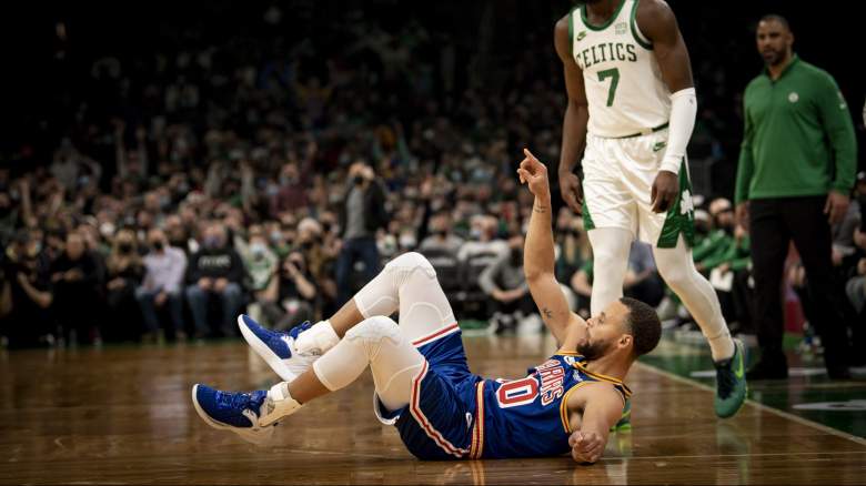 Stephen Curry of the Warriors celebrates after a tough 3-pointer against the Celtics.