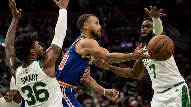 The Celtics defend Warriors star Stephen Curry.