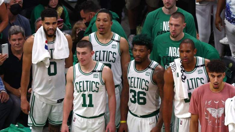 Multiple members of the Boston Celtics on the bench.