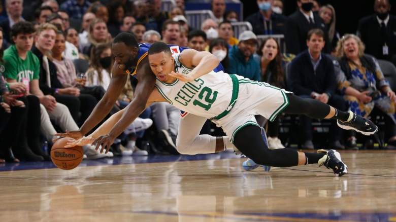 Grant Williams diving for a loose ball with Draymond Green during the NBA Finals