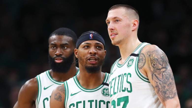 Jaylen Brown and Marcus Smart and Daniel Theis of the Boston Celtics.