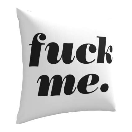 White pillow with black racy text