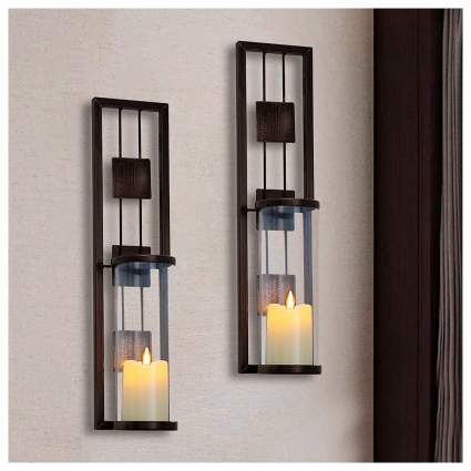Metal wall sconces with candles